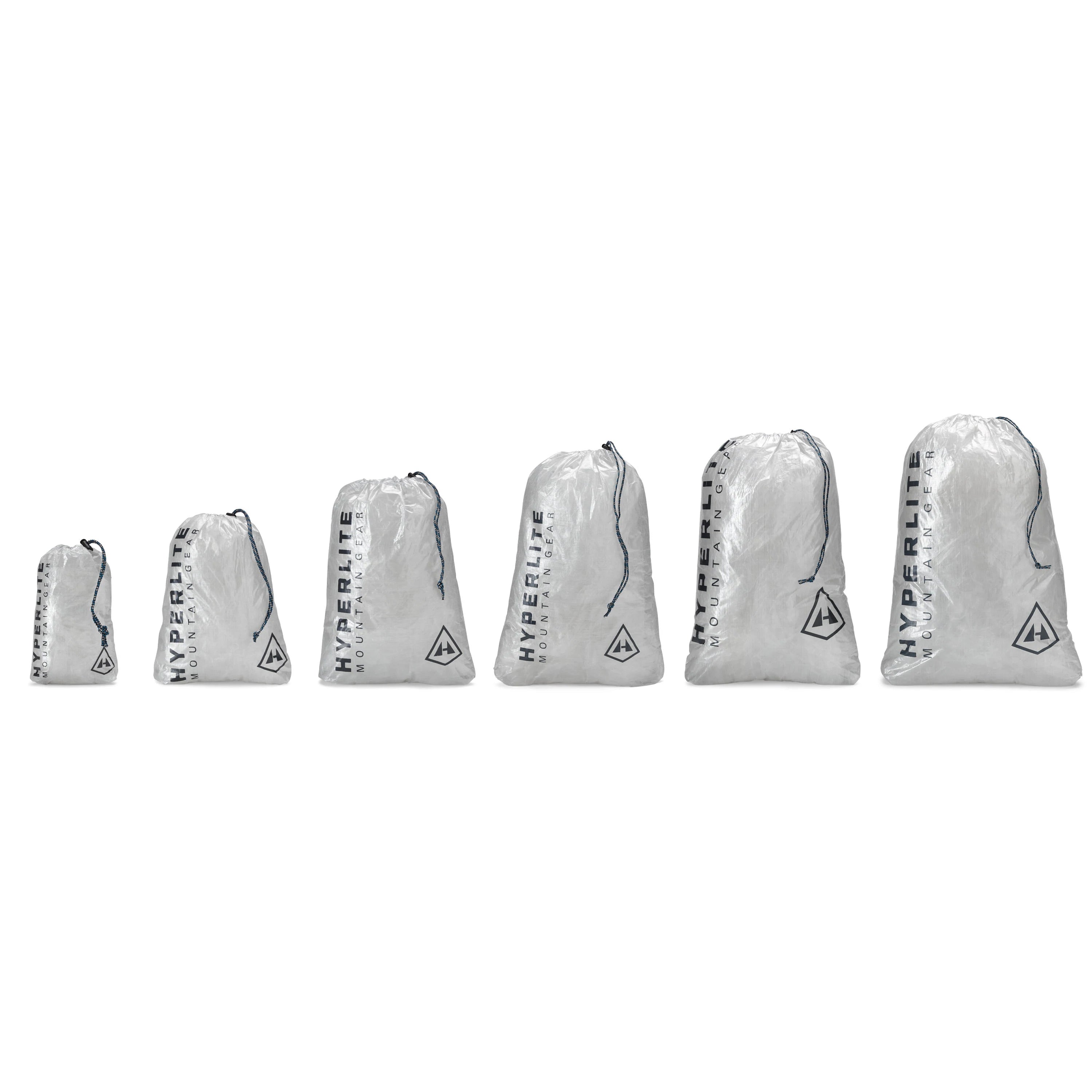 A group of bags with different colors and logos on them.