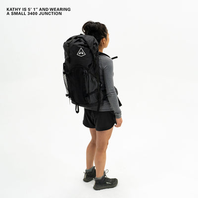 Left side view of Hyperlite Mountain Gear's Junction 55 Pack in Black on model