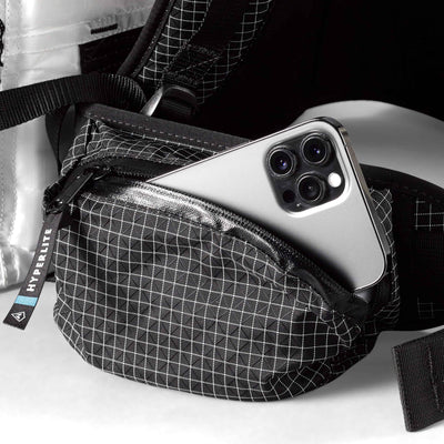 Detail shot of a the zippered hip belt pocket of Hyperlite Mountain Gear Junction 55 Pack in White
